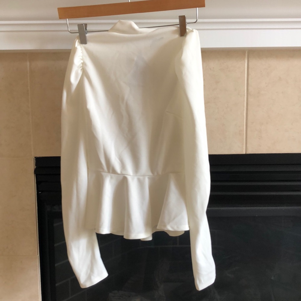 Fashion Nova white “Just roll with it” peplum top